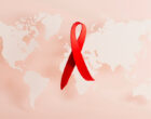 3d rendering illustration Aids hiv Awareness, World Day concept with red ribbon heart shape, copy space text. Clean minimalistic banner background with map