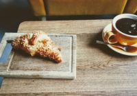 pastry-bread-beside-brown-ceramic-teacup-with-coffee-3172623