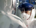 Checking_Personal_Protective_Equipment_(PPE)_in_the_fight_against_Ebola_(15650272810)