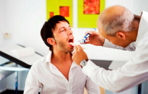A patient undergoing a mouth examination